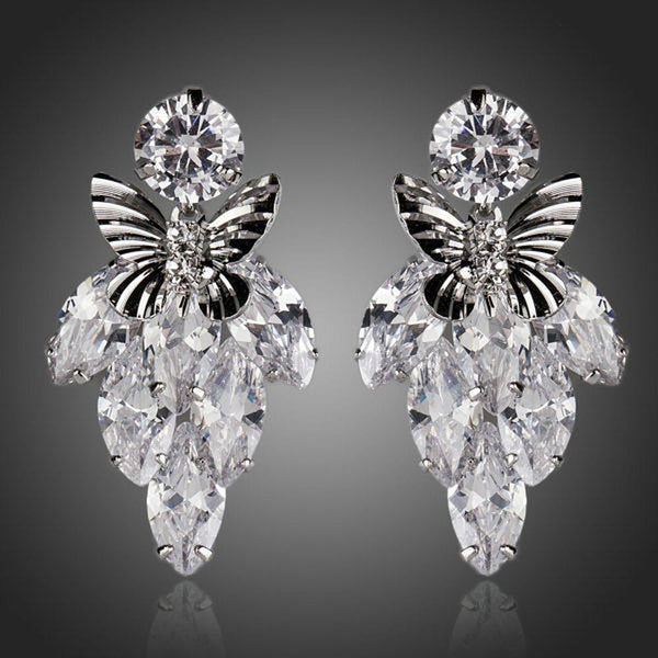 KHAISTA sitting butterfly crystal drop earrings on white background