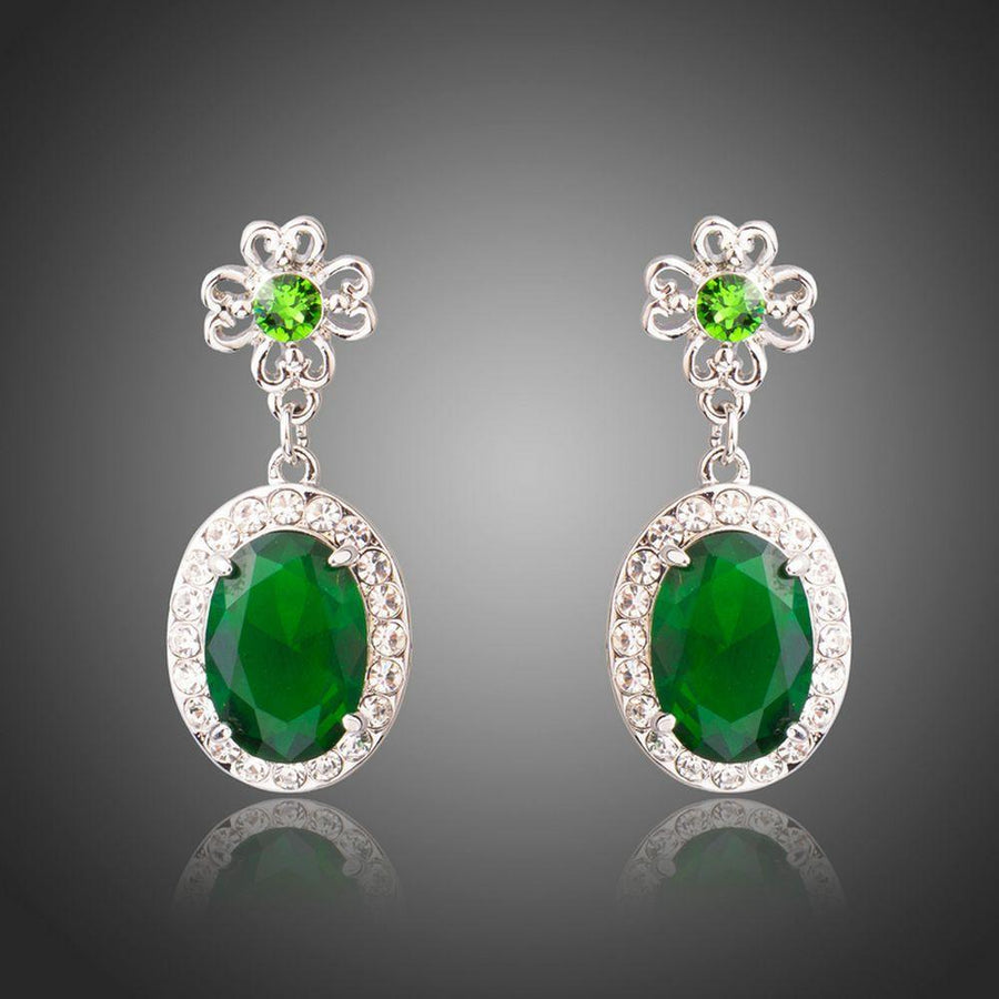 KHAISTA space green oval CZ drop earrings on white background