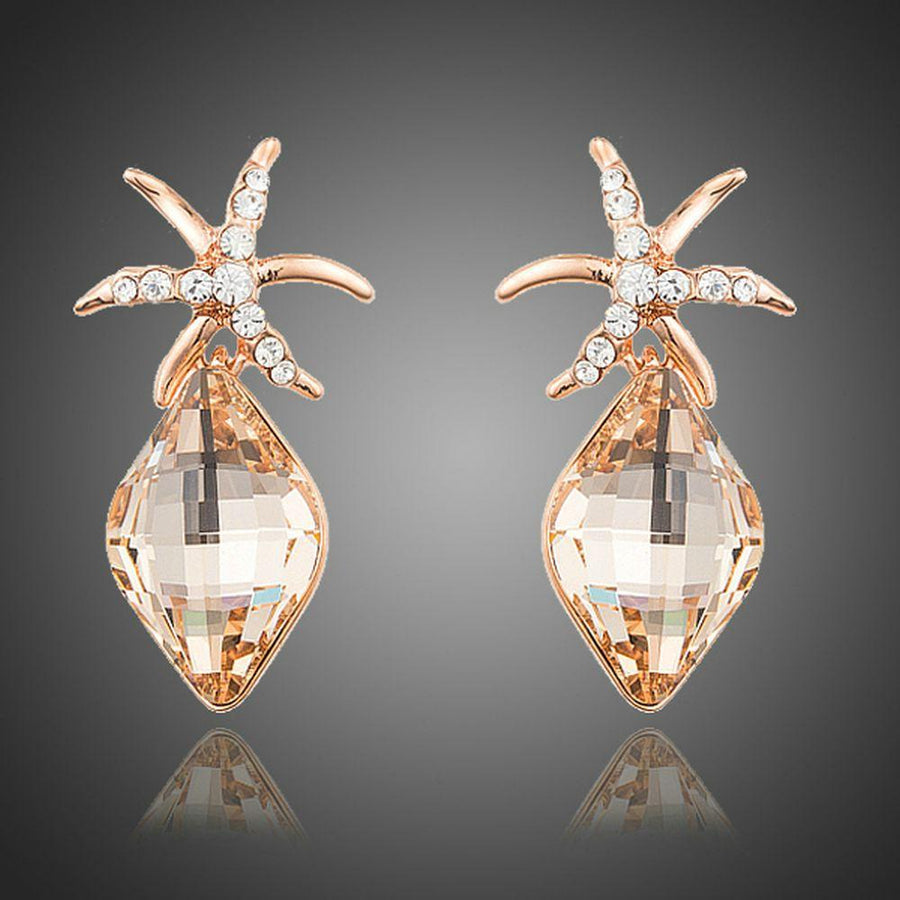 KHAISTA starfish rhinestone drop earrings on white background