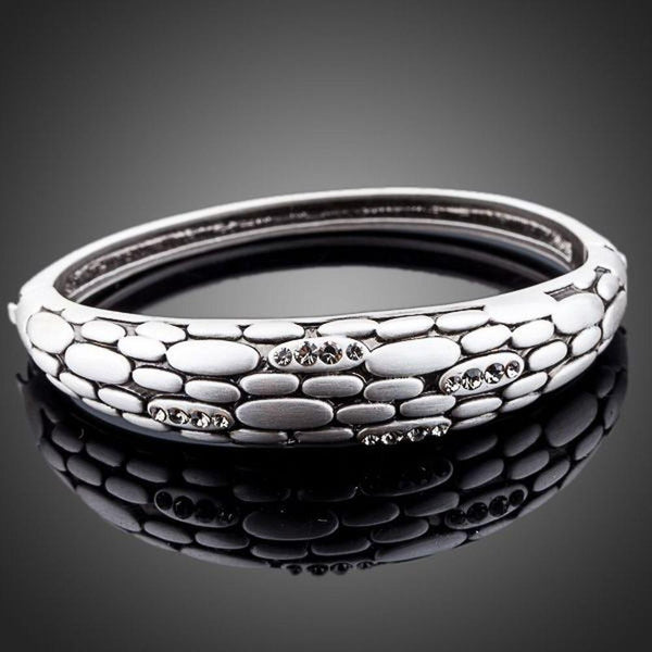 KHAISTA stone wall design crystal bangle on white background