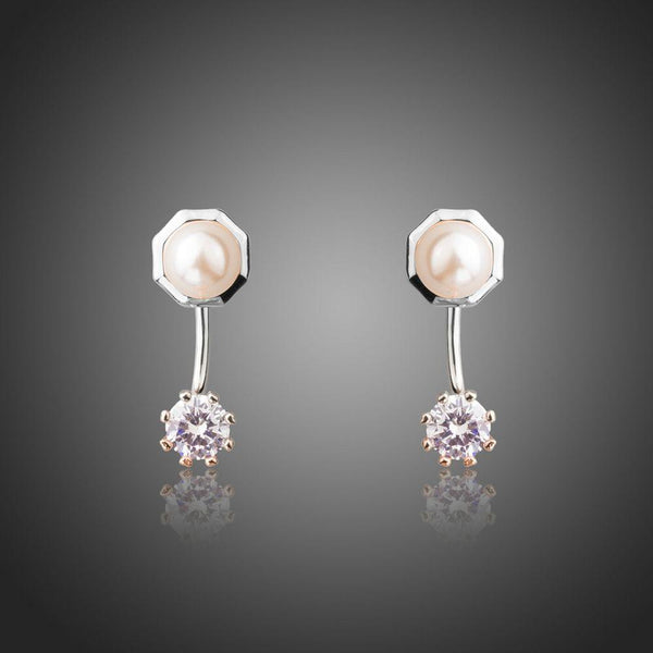 KHAISTA synthetic pearl stud earrings on white background