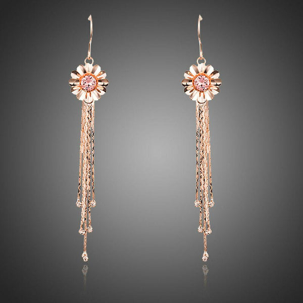 KHAISTA rose gold Stellux tassel drop earrings on white background