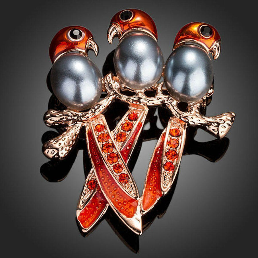 Khaista three red birds crystal brooch on white background
