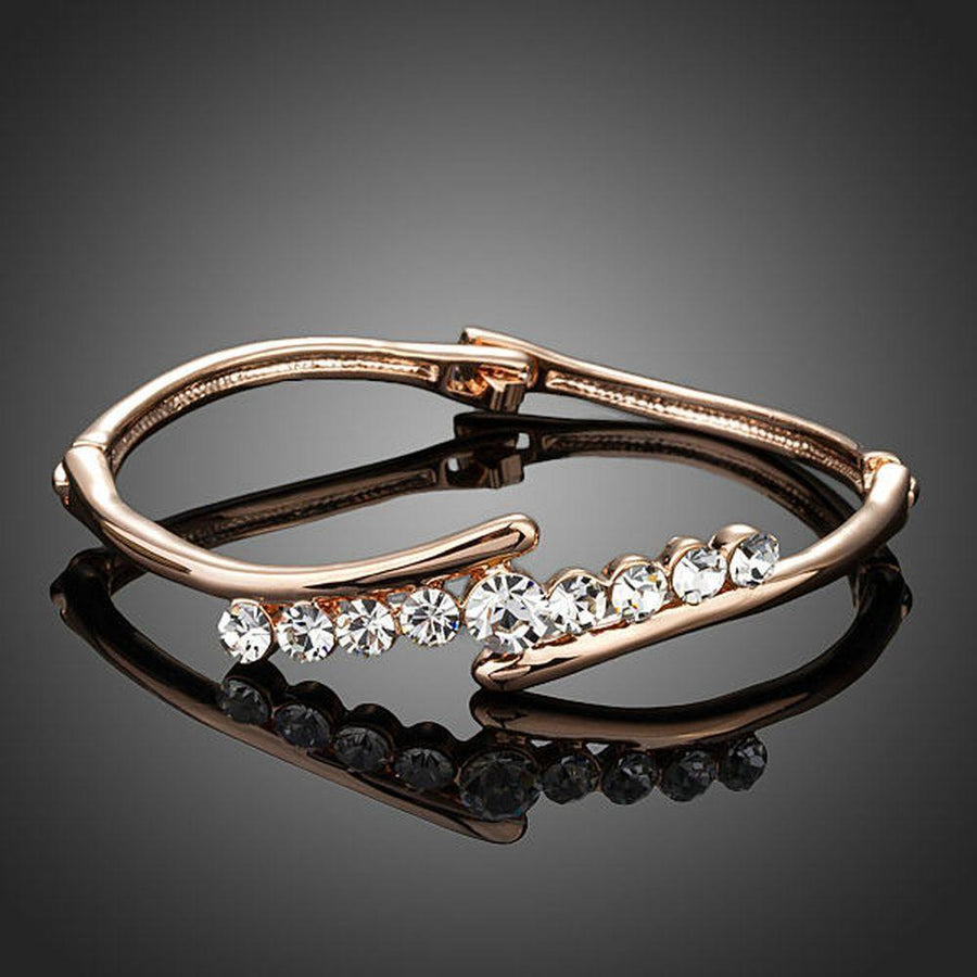 KHAISTA twist design crystal bangle on white background