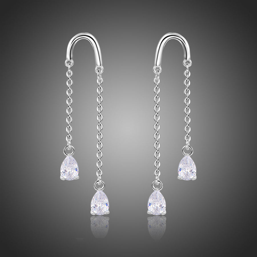 KHAISTA U-shape pear cut crystal earrings on white background