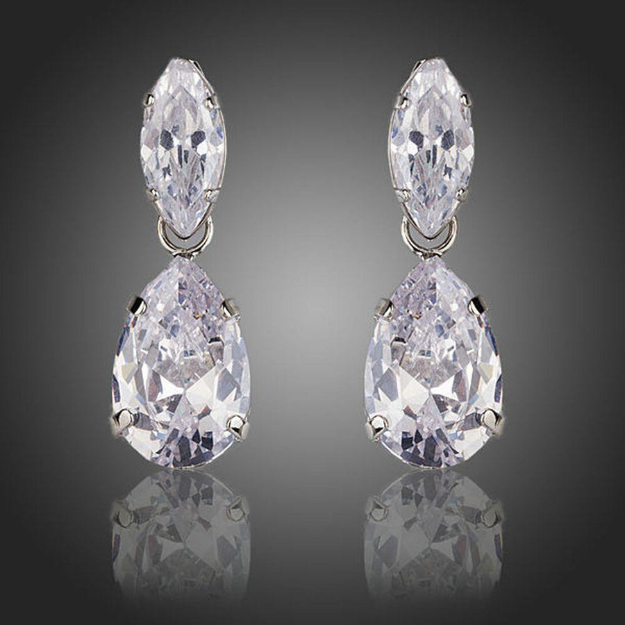 KHAISTA waterfall crystal drop earrings on white background