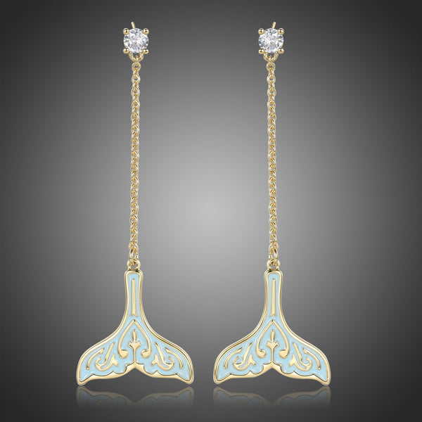 KHAISTA crystal whale fluke drop earrings on white background