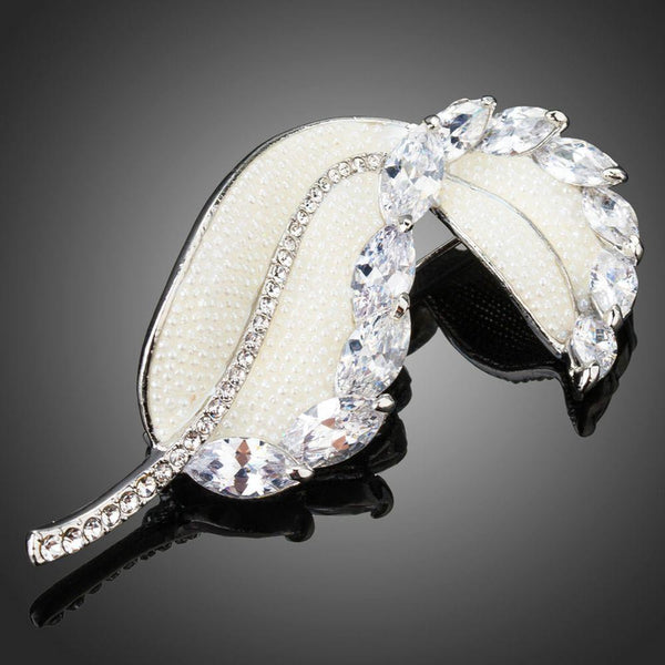 Khaista white crystal banana leaf brooch on white background