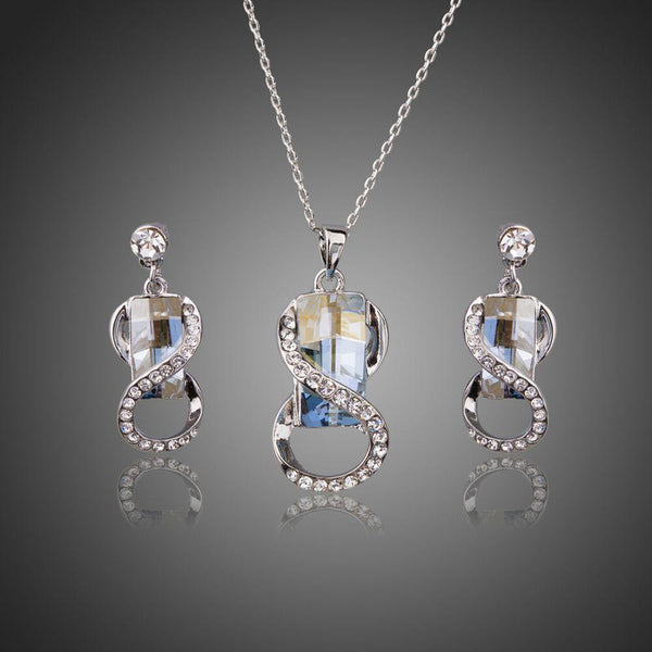 Khaista blue crystal white gold necklace earrings set on white background