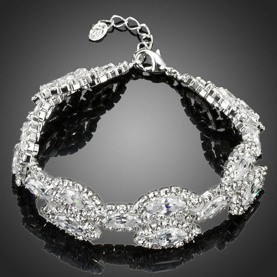 KHAISTA white gold CZ tennis bracelet on white background