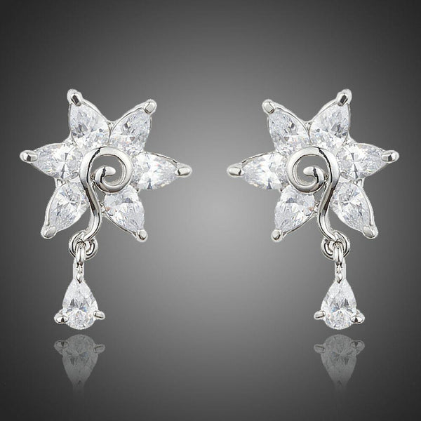 KHAISTA white rose CZ waterdrop earrings on white background