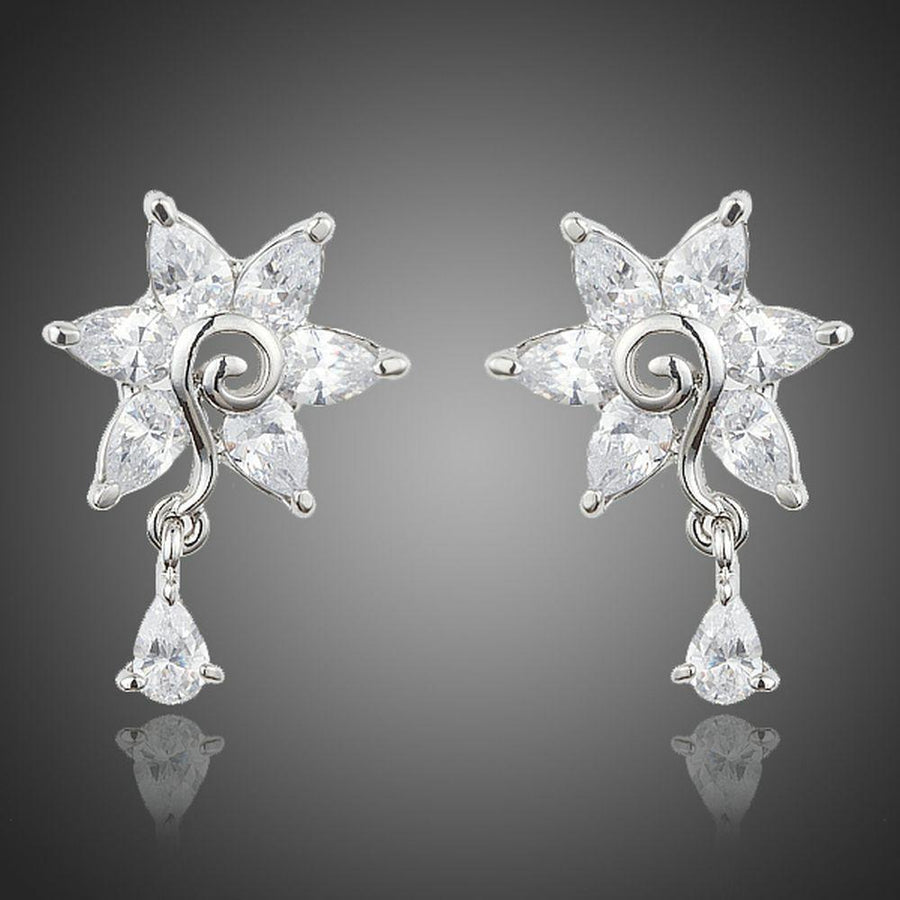 KHAISTA white rose CZ waterdrop earrings on white background