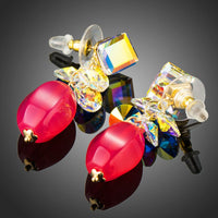 Side angle view of KHAISTA cube Stellux Austrian crystal drop earrings