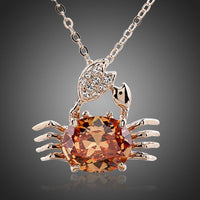 KHAISTA champagne crystal crab pendant necklace on white background
