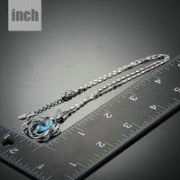 Pendant detail on KHAISTA light blue crystal flower necklace