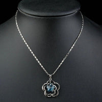 Close up detail of KHAISTA light blue crystal flower necklace