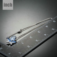 Pendant detail on KHAISTA blue crystal dragonfly pendant necklace