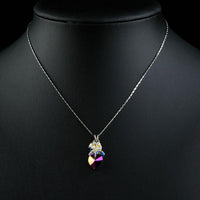 Close up detail of KHAISTA crystal heart pendant necklace
