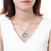 Pendant detail on KHAISTA light blue crown heart necklace