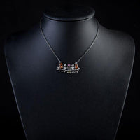 Close up detail of KHAISTA ancient sitting birds crystal necklace