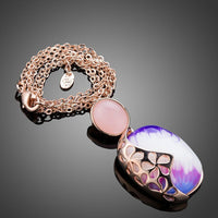 Close up detail of KHAISTA artist paint crystal pendant necklace