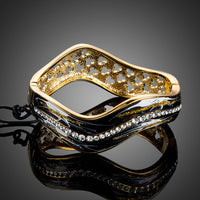 KHAISTA artistic black wave bangle on white background