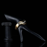 Close up detail of KHAISTA artistic black wave bangle
