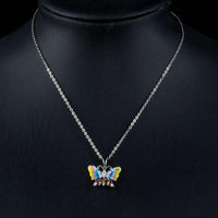 Side angle view of KHAISTA artistic crystal butterfly pendant necklace