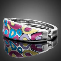 Close up detail of KHAISTA artistic canvas crystal bangle