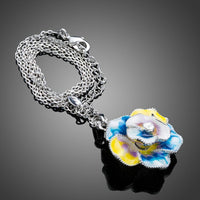 Side angle view of KHAISTA artistic crystal flower necklace