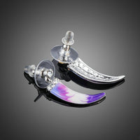 Close up of KHAISTA artistic crystal drop earrings