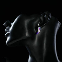 Side angle view of KHAISTA artistic crystal drop earrings