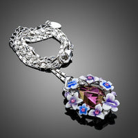 Side angle view of KHAISTA artistic multicolour Stellux Austrian necklace
