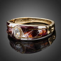 Close up detail of KHAISTA artistic oval crystal bangle