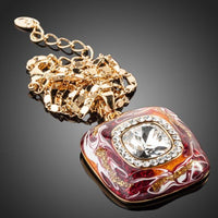 Close up detail of KHAISTA artistic squircle crystal pendant necklace