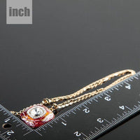 Pendant detail on KHAISTA artistic squircle crystal pendant necklace