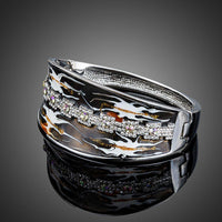 Close up detail of KHAISTA artistic windstorm crystal bangle