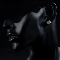 Close up of KHAISTA Austrian crystal rectangle stud earrings