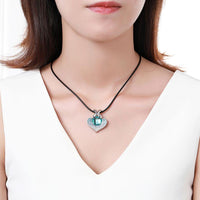 KHAISTA large blue Austrian crystal heart necklace on white background