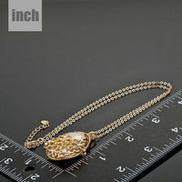 Pendant detail on KHAISTA large oval champagne crystal flower necklace