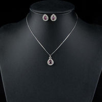 Side angle view of KHAISTA purple pear set