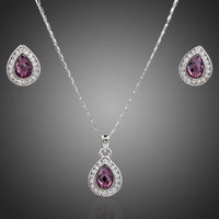 KHAISTA large pear purple crystal jewellery set on white background