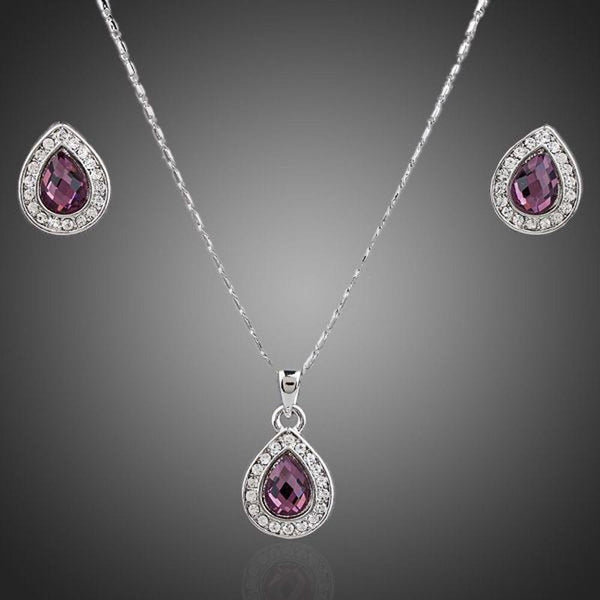 KHAISTA large pear purple crystal jewellery set on white background