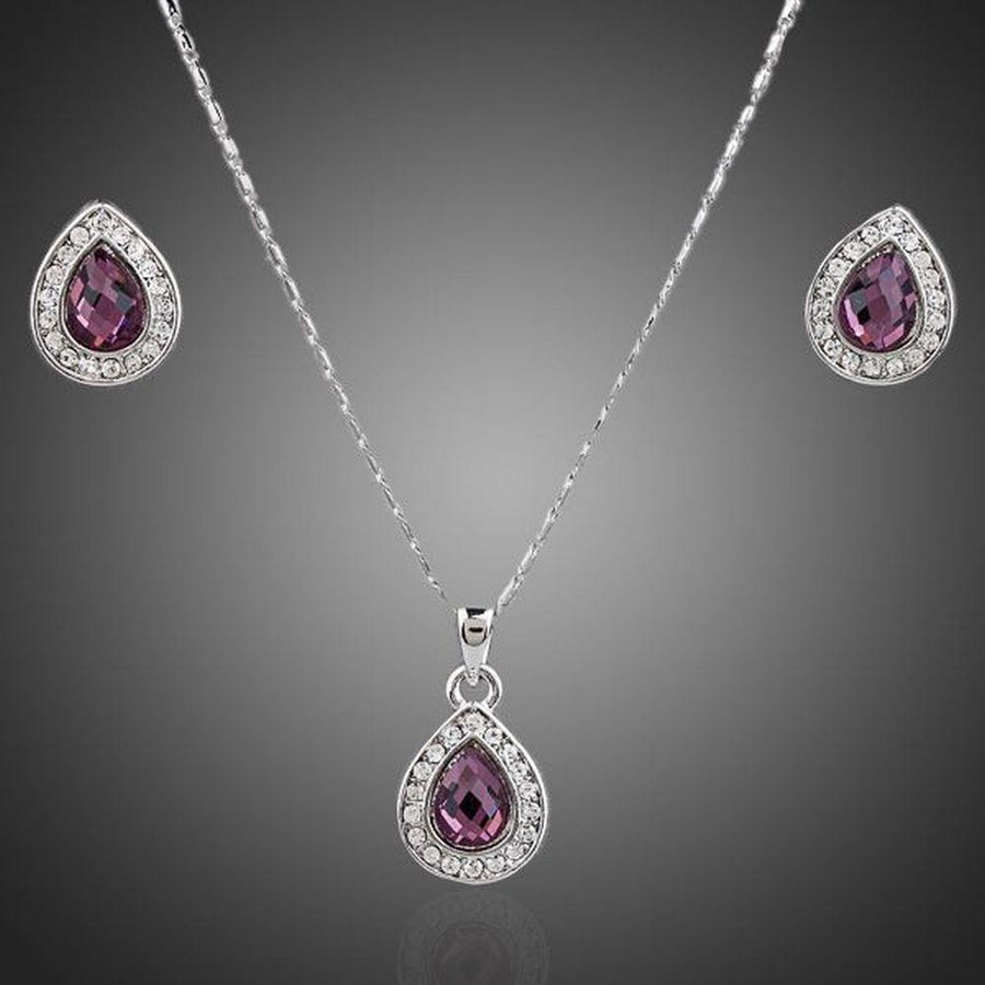 KHAISTA large pear purple crystal jewellery set on white background