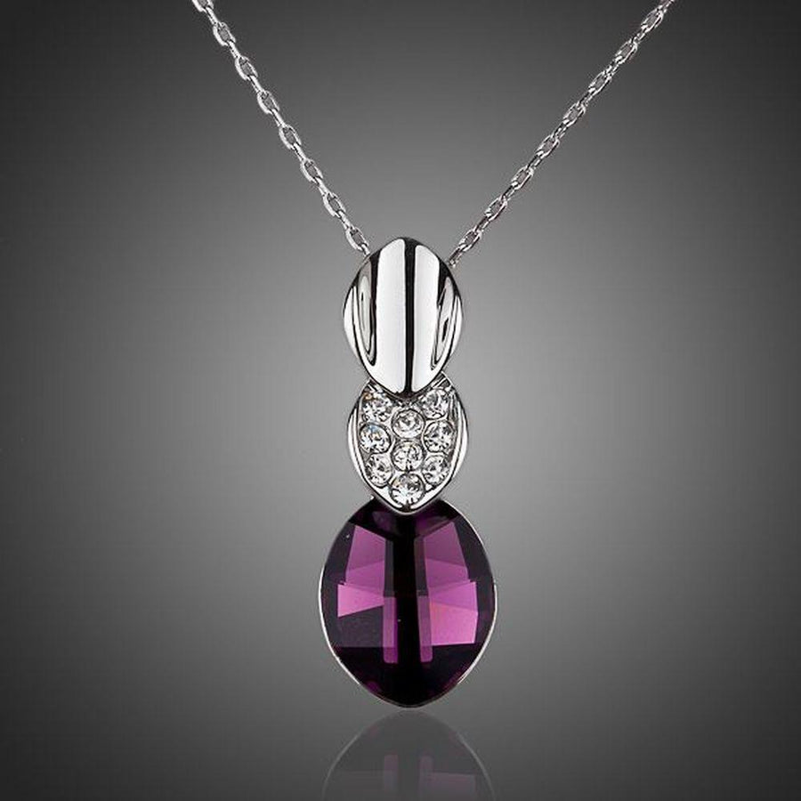KHAISTA large purple crystal pendant necklace on white background