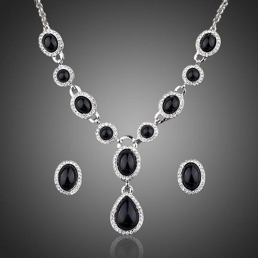 Khaista black crystal necklace and earrings set on white background