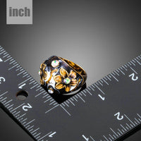 Artistic craftsmanship and structured profiles of the elegant black floral statement ring