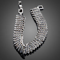 Close up detail of KHAISTA black CZ link chain bangle