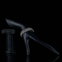 Side angle view of KHAISTA black CZ link chain bangle