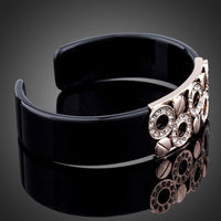 Close up detail of KHAISTA black round designer crystal bangle
